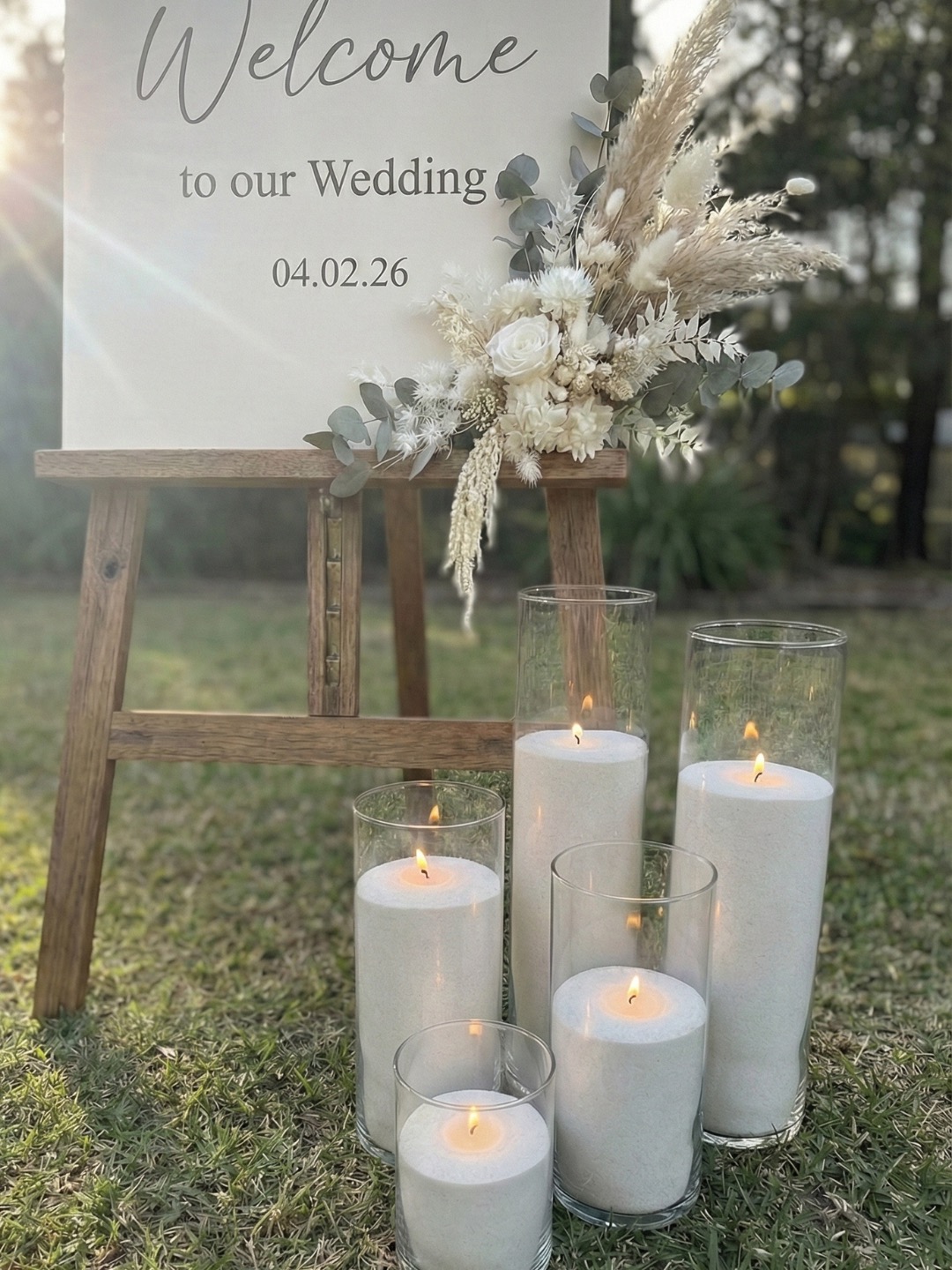 Glass candle vessels adding warm wedding ambience