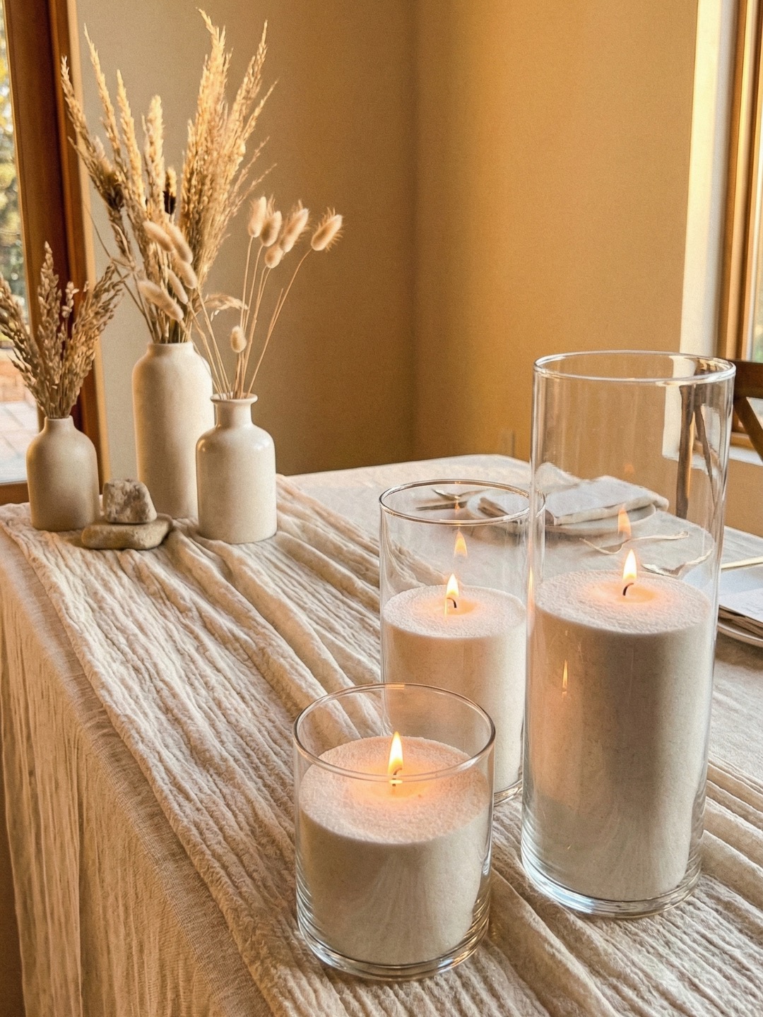 Ready-to-light candles styled for an event table
